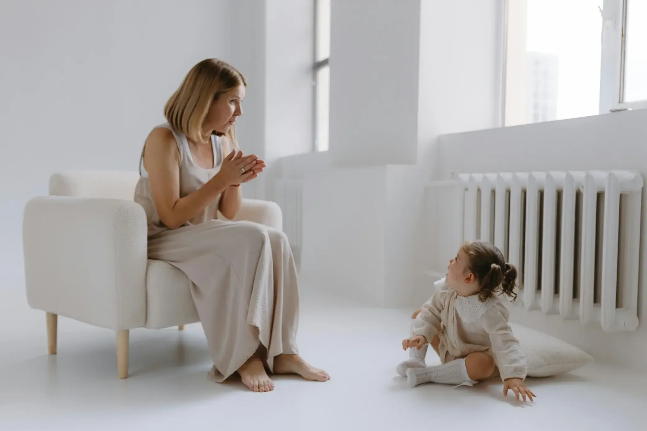 Mother and child near home radiator