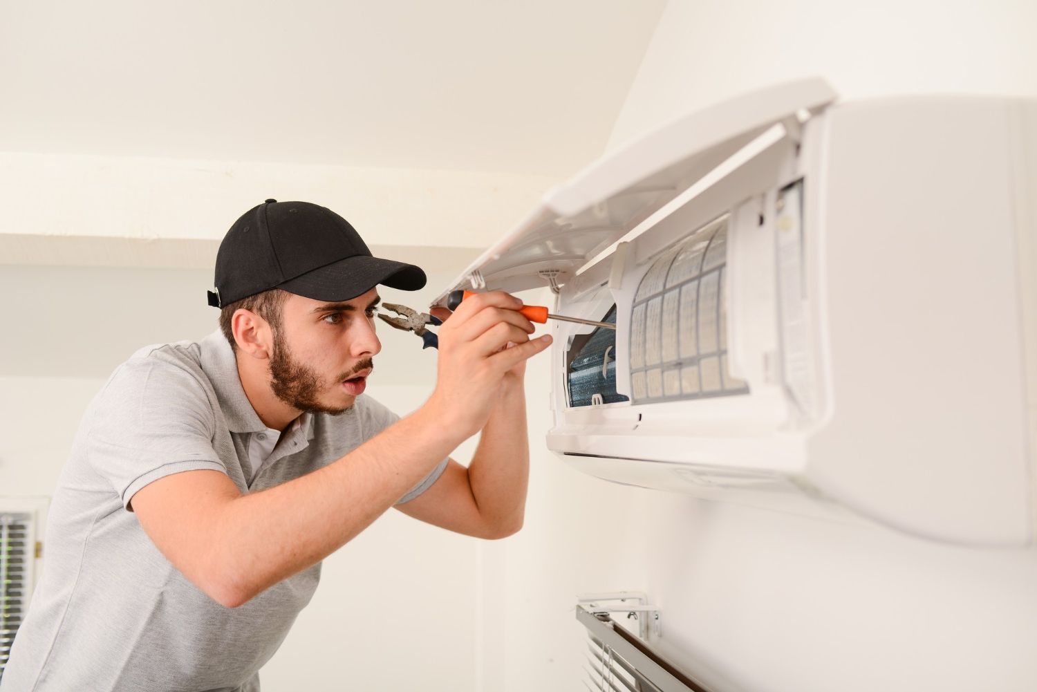 HVAC technician repairing system