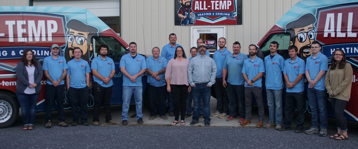 All temp team pictured all together out front of business
